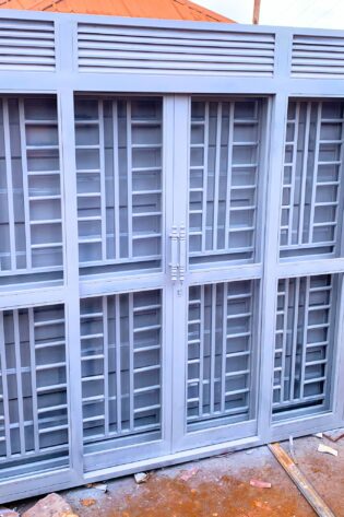 Modern steel 3-way security door with a powder-coated finish, custom manufactured by Trust and Smart Metals for residential and commercial buildings.