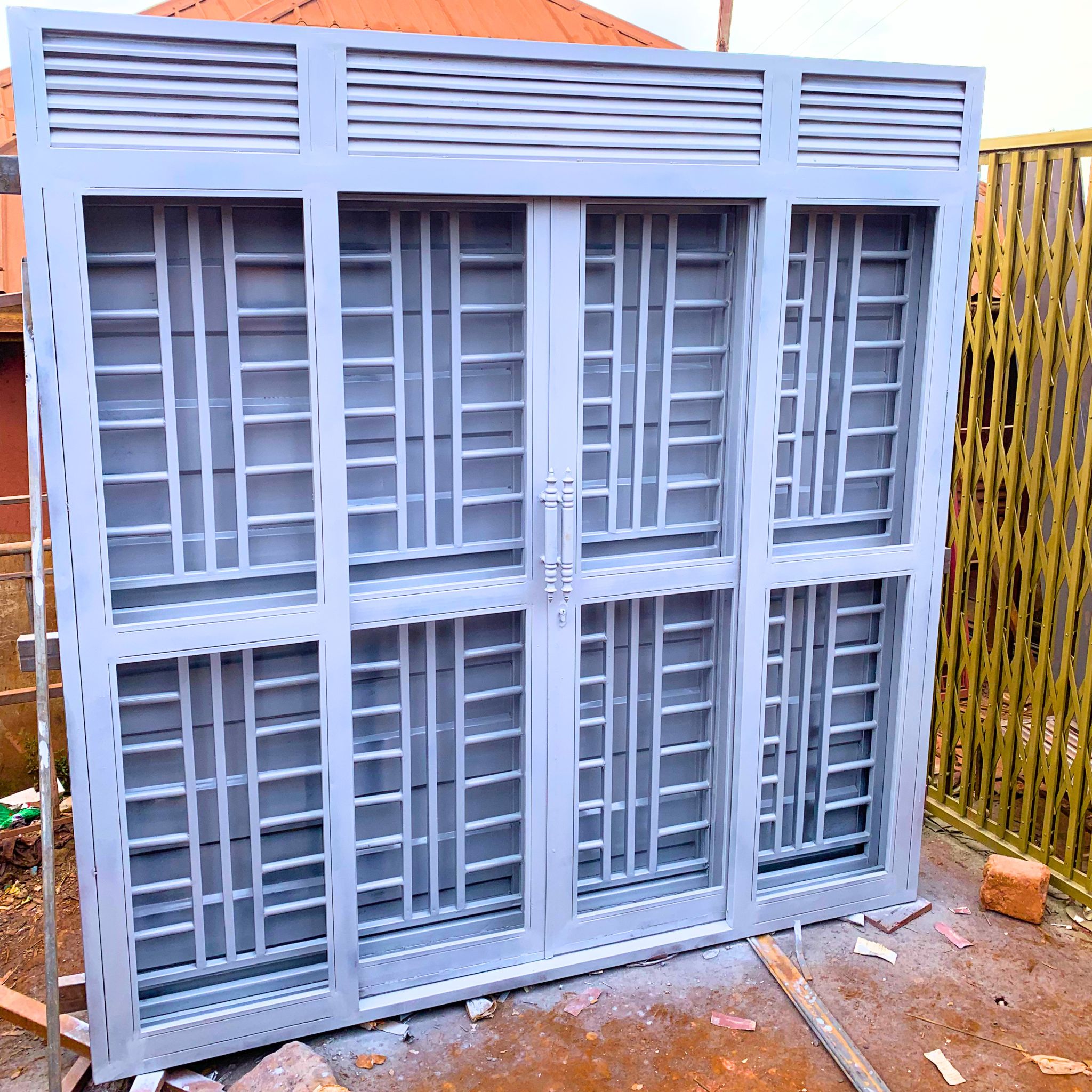 Modern steel 3-way security door with a powder-coated finish, custom manufactured by Trust and Smart Metals for residential and commercial buildings.