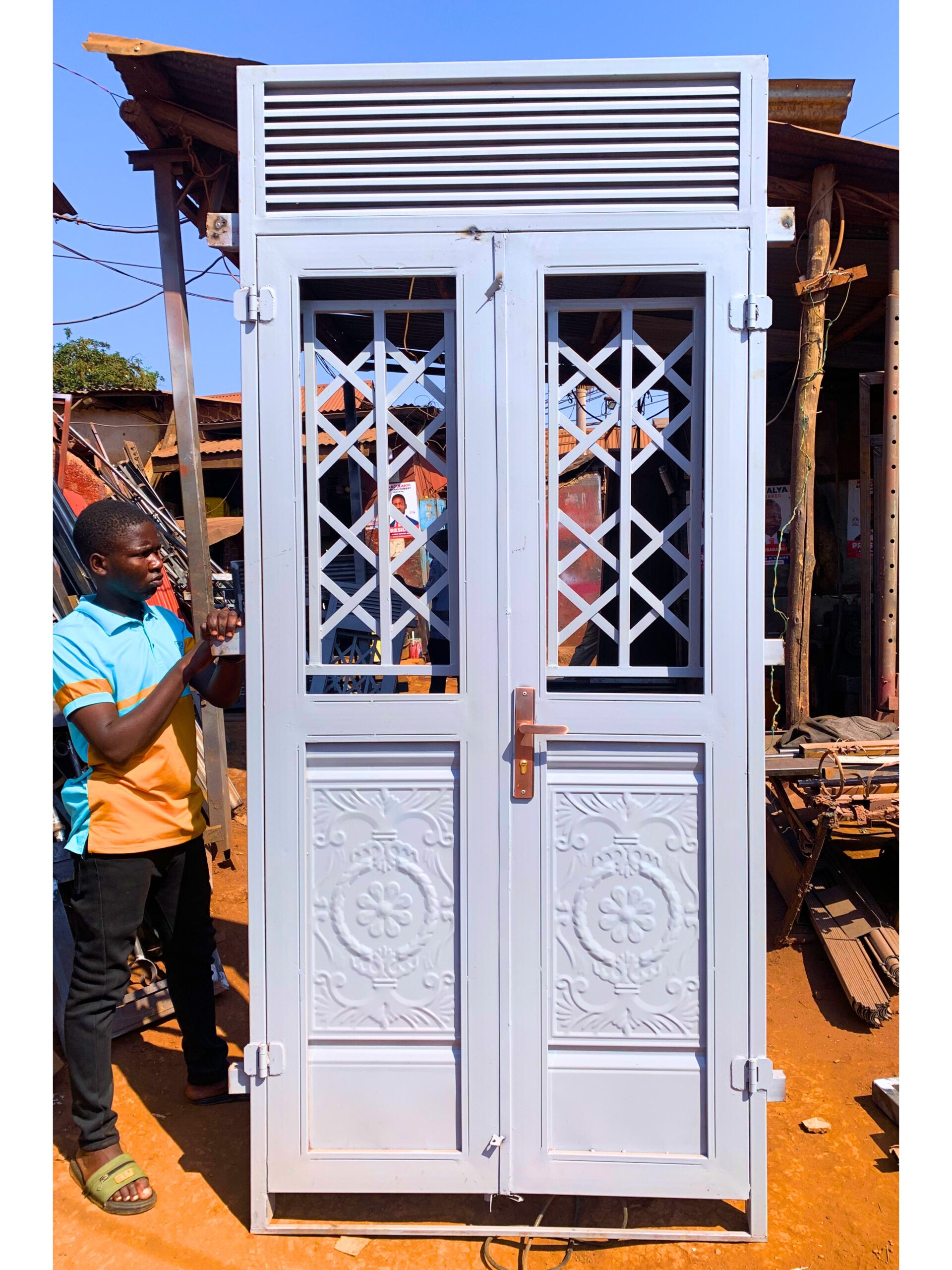 Modern steel front door with a powder-coated finish, custom manufactured by Trust and Smart Metals for residential and commercial buildings.