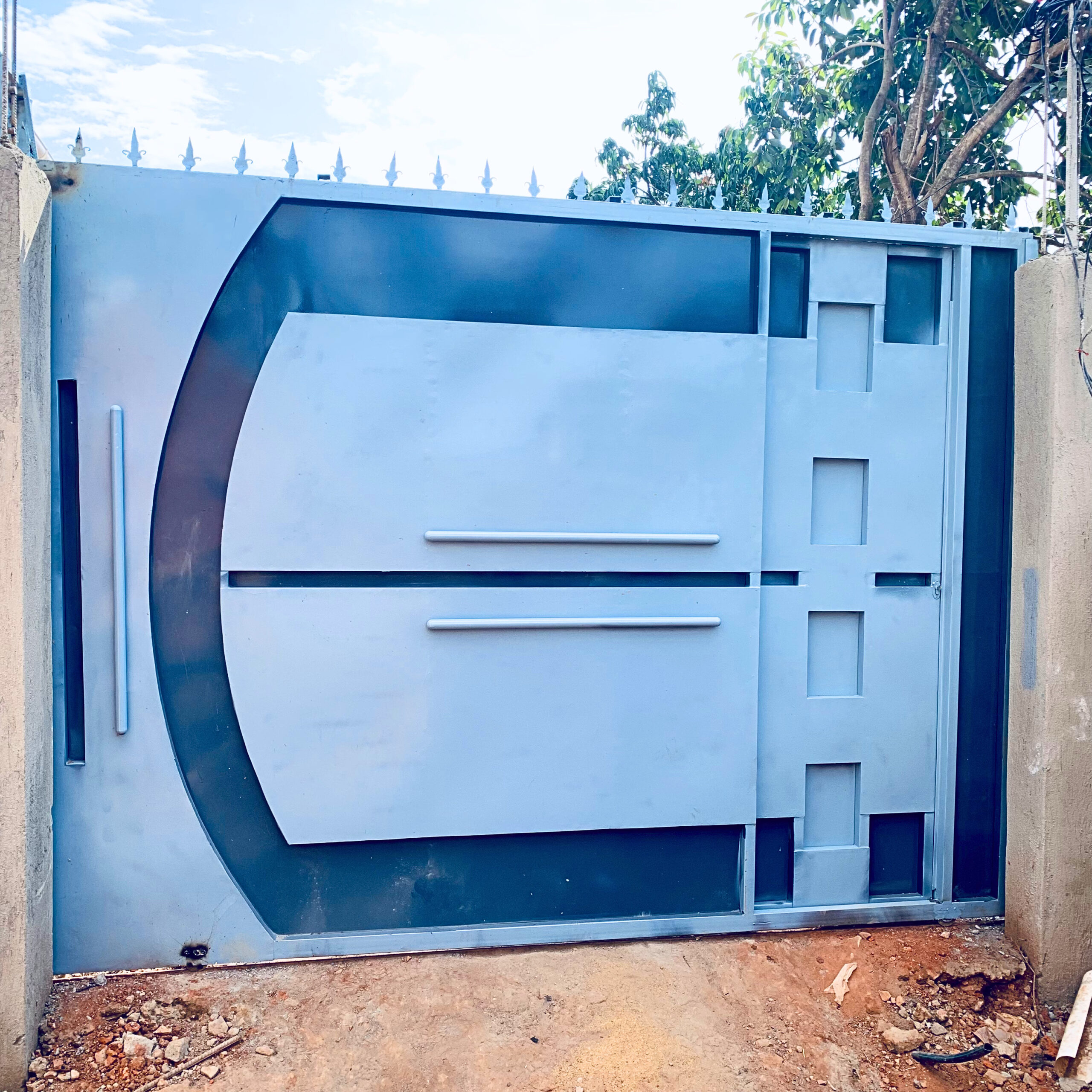 steel modern steel sliding gate manufactured and installed by Trust and Smart Metals.