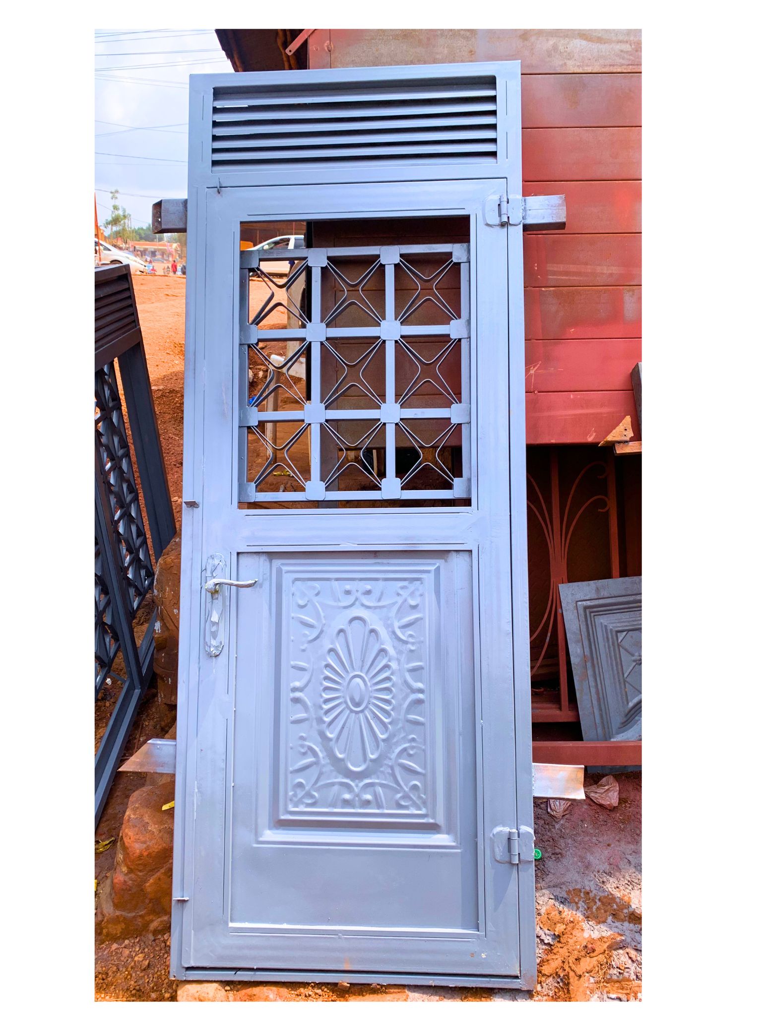 Modern steel half plate design door with a powder-coated finish, custom manufactured by Trust and Smart Metals for residential and commercial buildings.