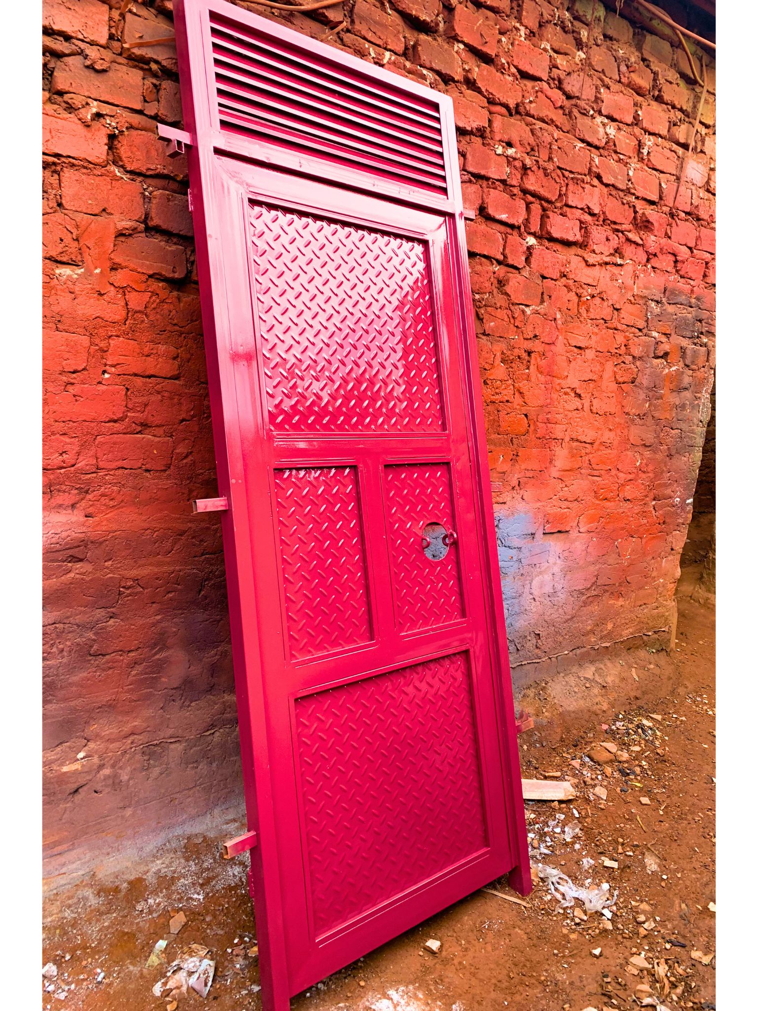 Modern steel plate door with a heavy-duty powder-coated finish, custom manufactured by Trust and Smart Metals.