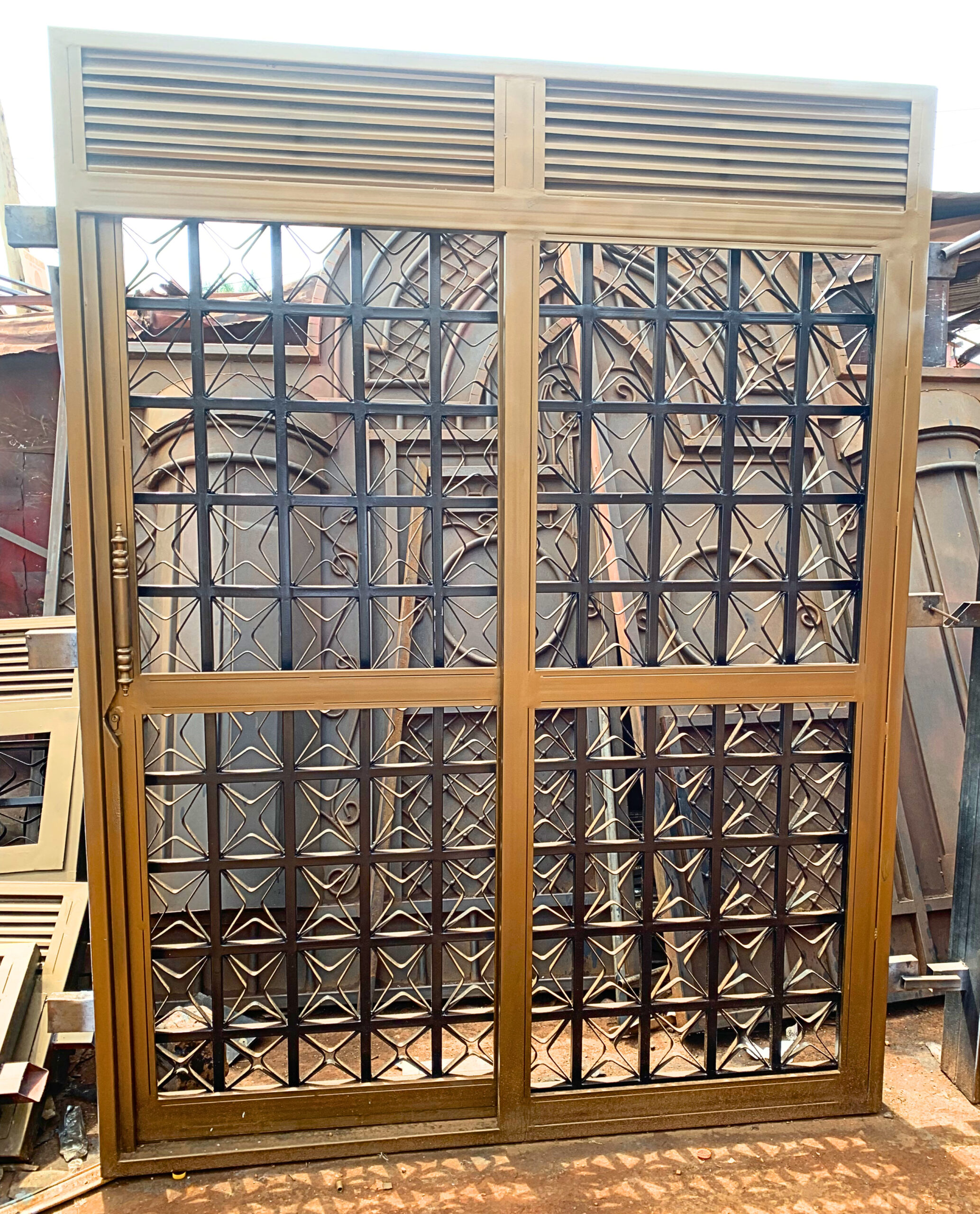 Modern steel sliding single door with powder-coated finish for residential and commercial buildings by Trust and Smart Metals.