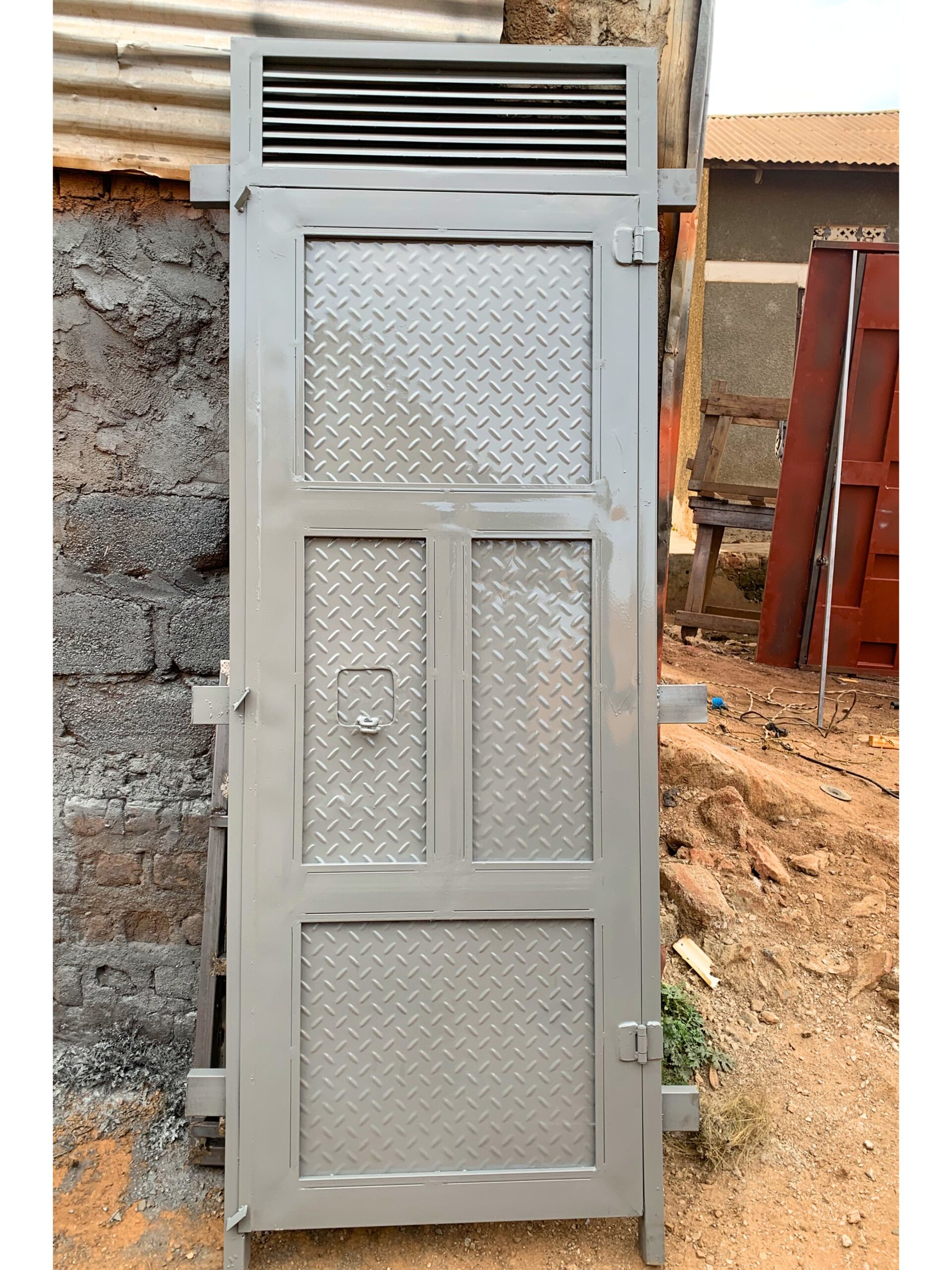 Heavy-duty steel behind door with a solid plate design for enhanced security, manufactured by Trust and Smart Metals.