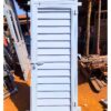 Modern steel plate door with a heavy-duty powder-coated finish, custom manufactured by Trust and Smart Metals for residential and commercial buildings.