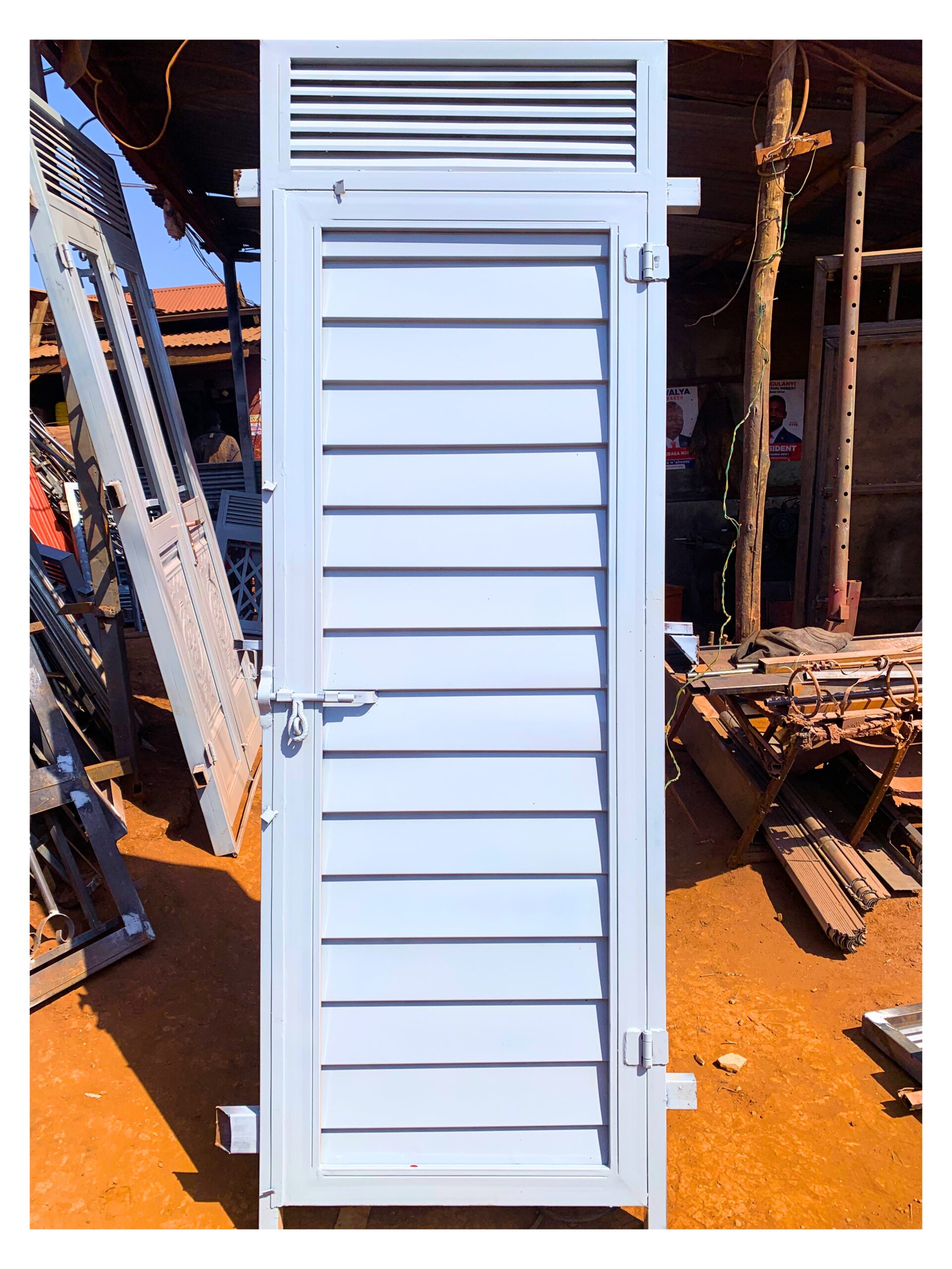Modern steel plate door with a heavy-duty powder-coated finish, custom manufactured by Trust and Smart Metals for residential and commercial buildings.