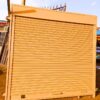 Modern steel roller shutter door with a durable powder-coated finish, custom manufactured by Trust and Smart Metals for residential and commercial buildings.