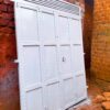 Modern steel bi-fold door with a durable powder-coated finish, custom manufactured by Trust and Smart Metals for residential and commercial buildings.