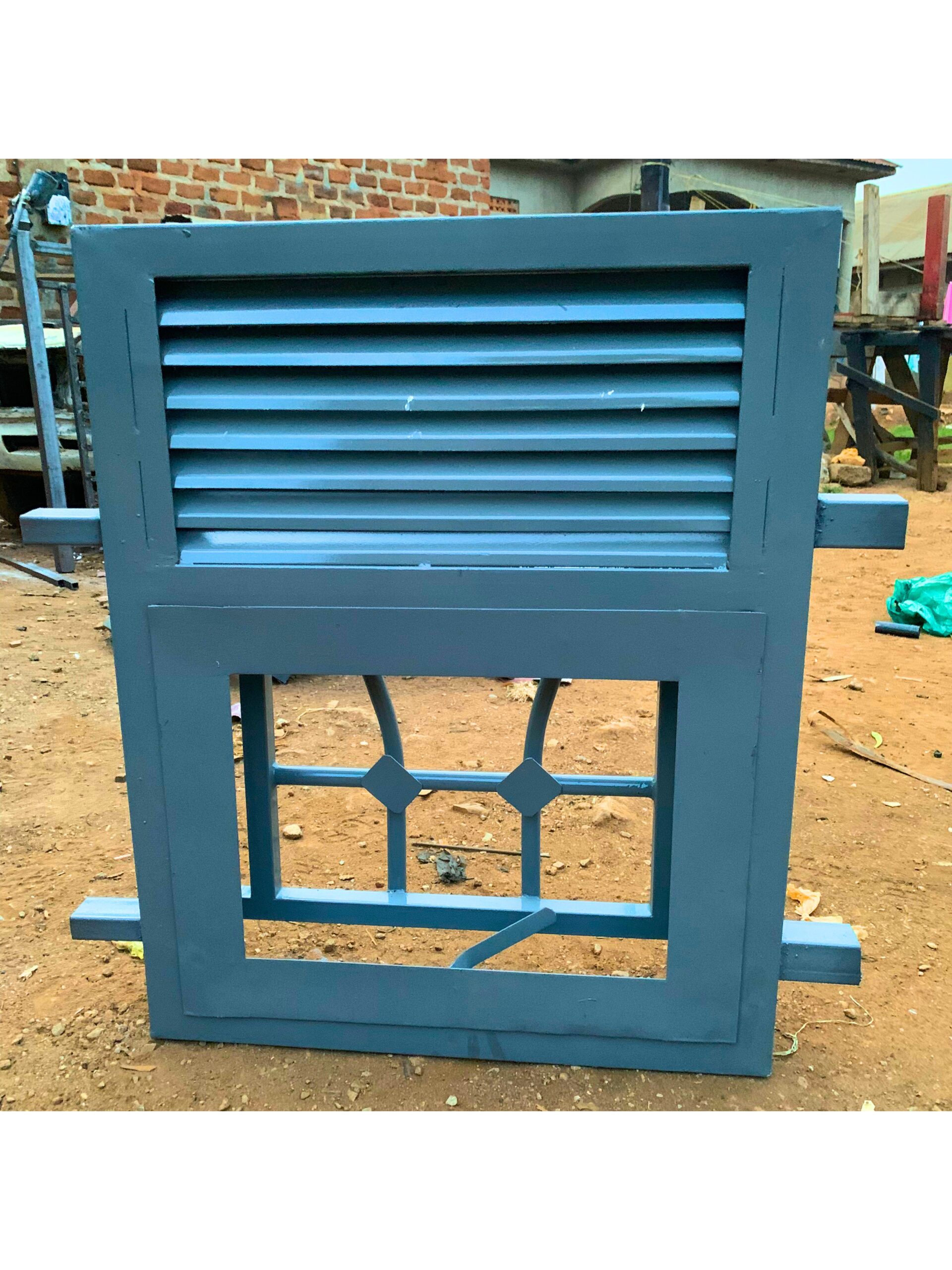 Modern steel washroom window with frosted glass and a powder-coated finish, custom manufactured by Trust and Smart Metals